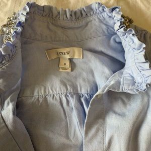 Sleeveless dress top and white capris